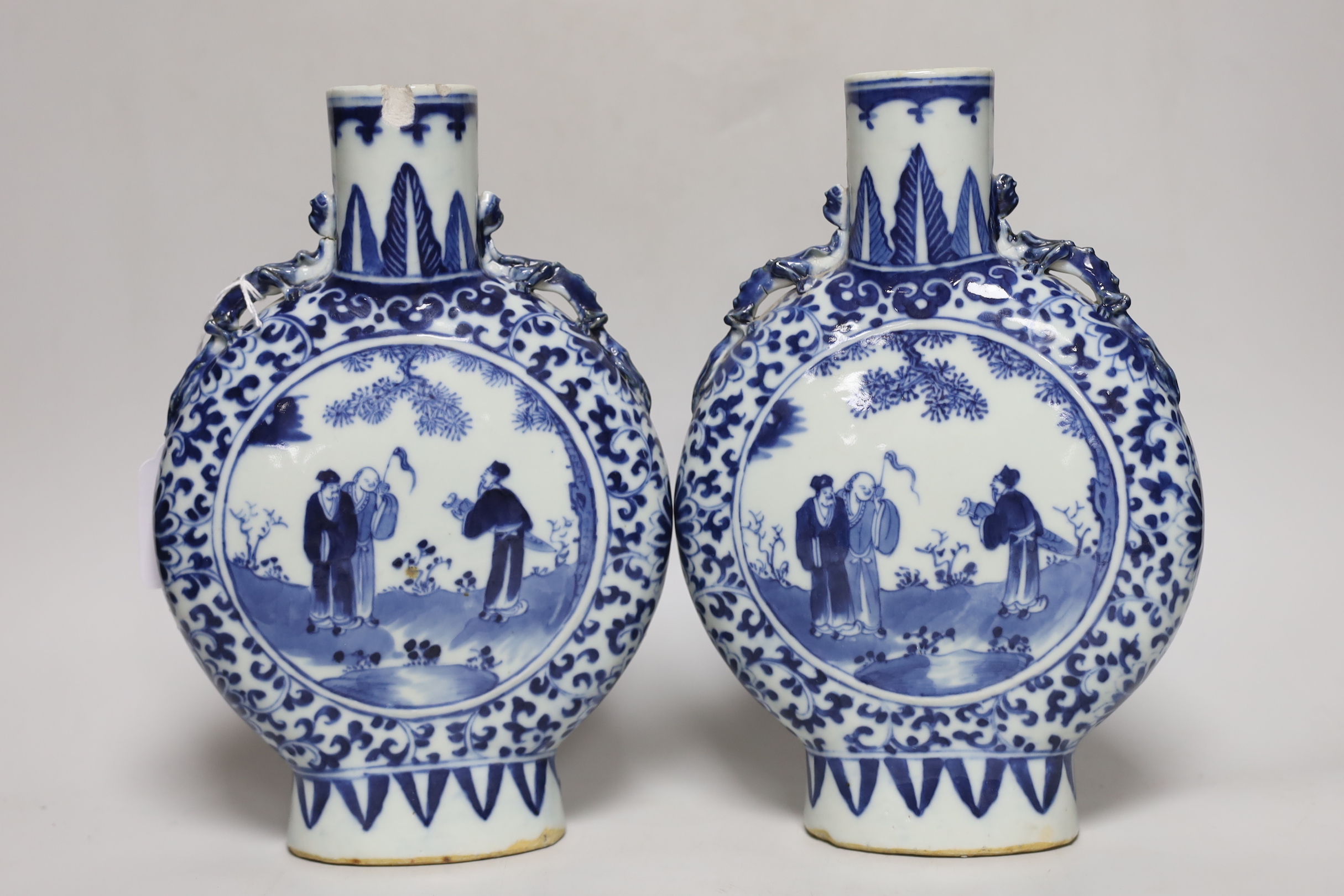 A pair of 19th century Chinese blue and white moonflasks, 26cm high